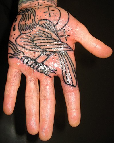 Religious hand tattoo bird hand tattoo 